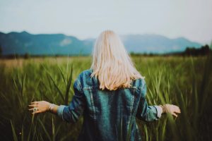 Woman Standing on Crop Field